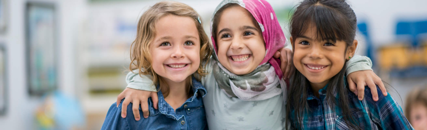 three children embracing